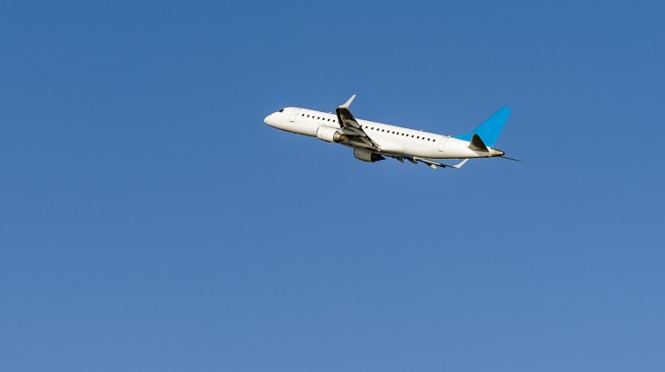 A plane flying in Israeli sky during day.