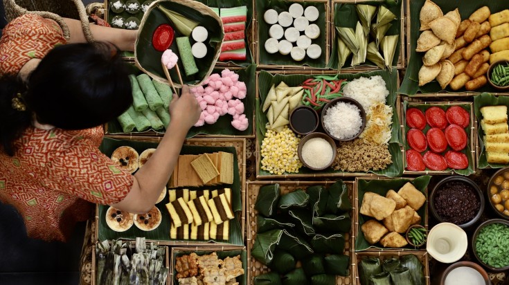 Top view of market stall selling traditional Indonesian sweet and savory sn