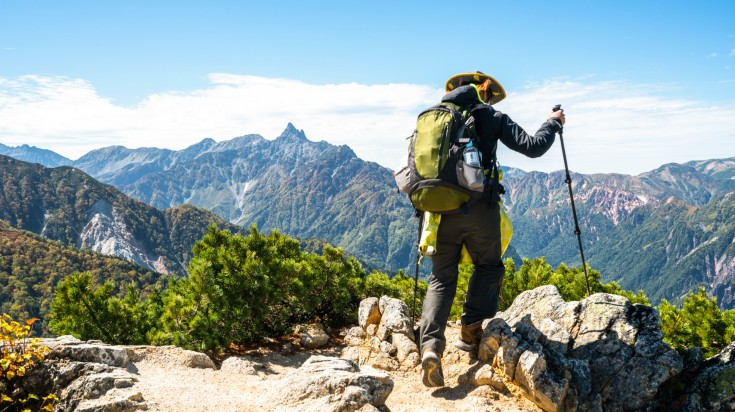 A hiker on the trails in the mountains in Japan in August.