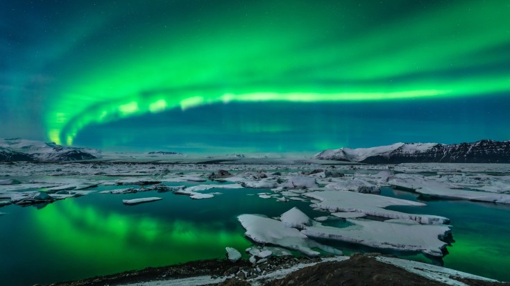 Jokulsarlon Glacier Lagoon under the Northern Lights in winter.