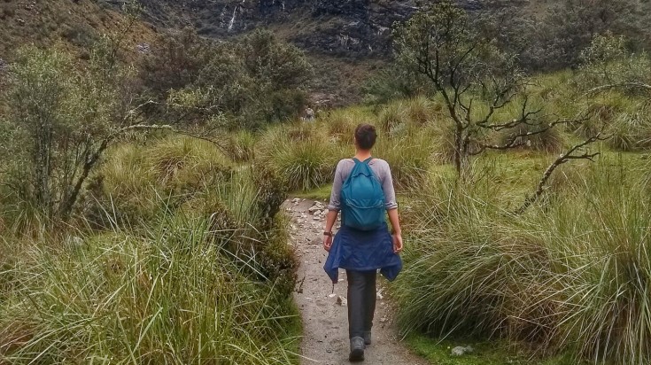 Woman hiking in Laguna 69 during summer.