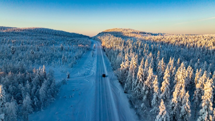 Snowy road through the Swedish lapland in November.