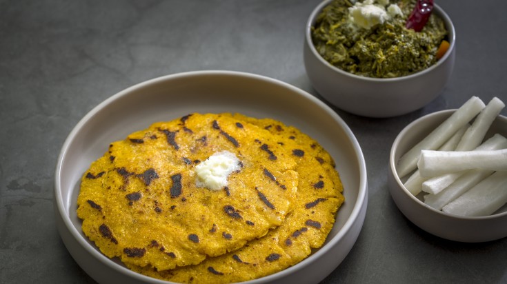 Makki di roti served with sarso da saag and radish.