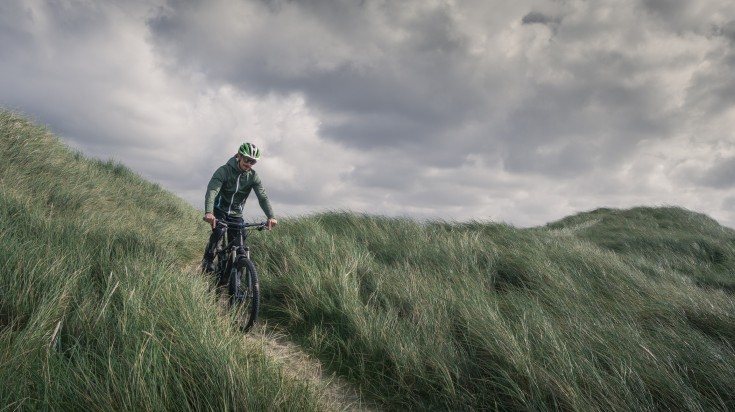 Man cycling near the Danish Coast on a cloudy day in September.