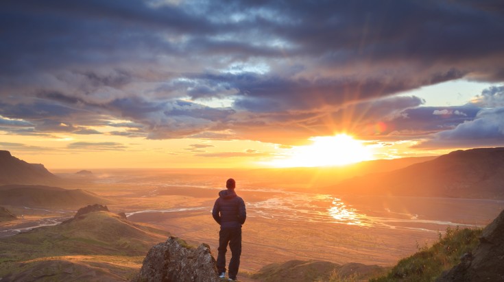 Man enjoying the sunset view in Thorsmork after a hike.