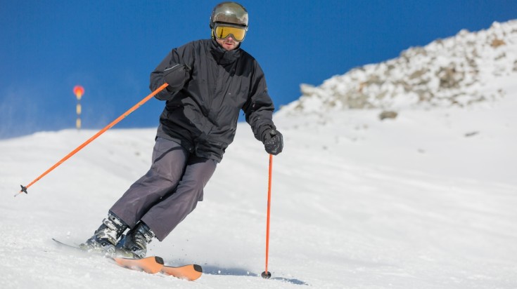 Man skiing at a Danish ski resort during the ideal weather of January.