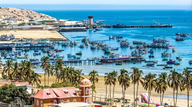 Boats lined up at the shore of Mancora in summertime.