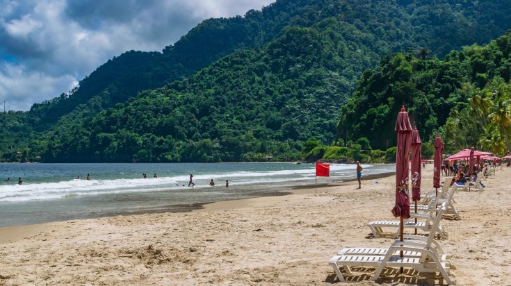 Visitors swimming in the Maracas Bay in summer.