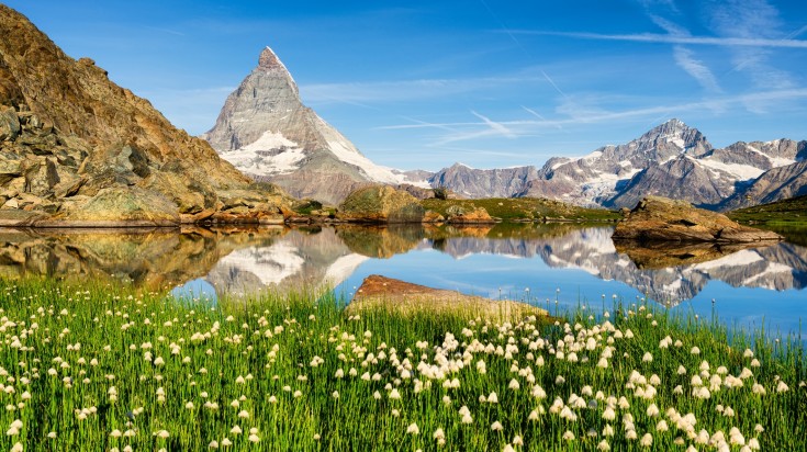 Watch Matterhorn and it's reflection on the water surface in Switzerland.