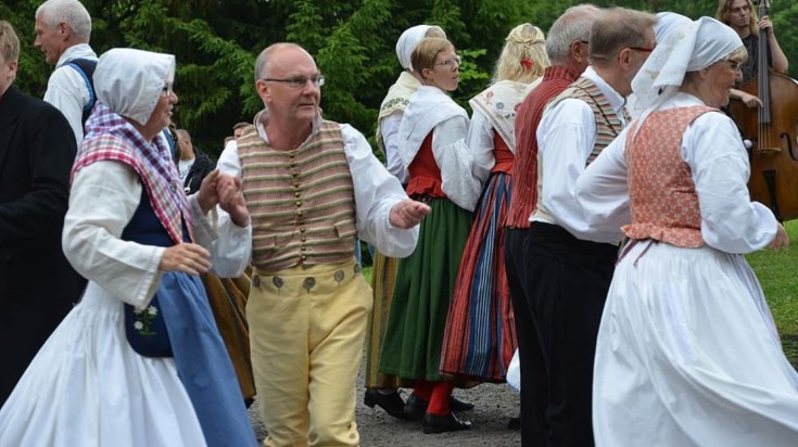 People dressed up for the midsummer festival in Sweden.