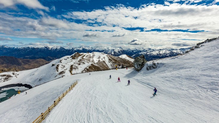 Try skiing in the slopes of Queenstown.