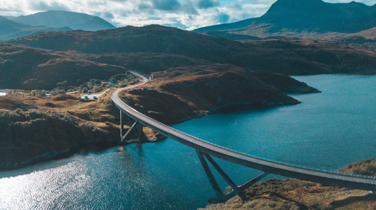 Drive on the Kylesku Bridge on the North Coast 500 road in Scotland.