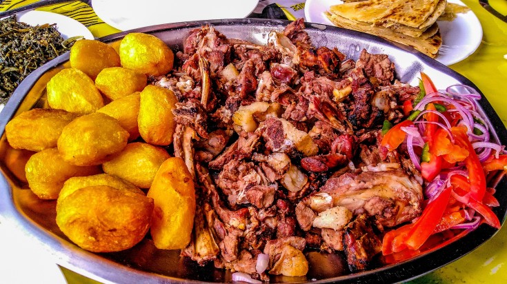 Nyama Choma with side dishes.