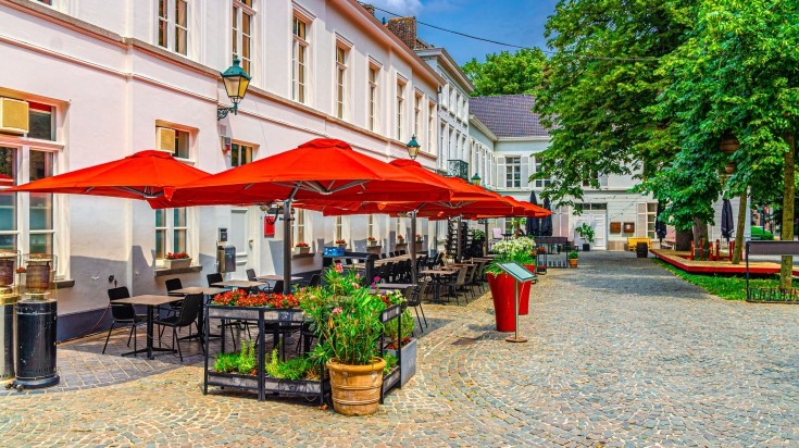 Outdoor cafe opens as weather becomes more bearable in Belgium in March.