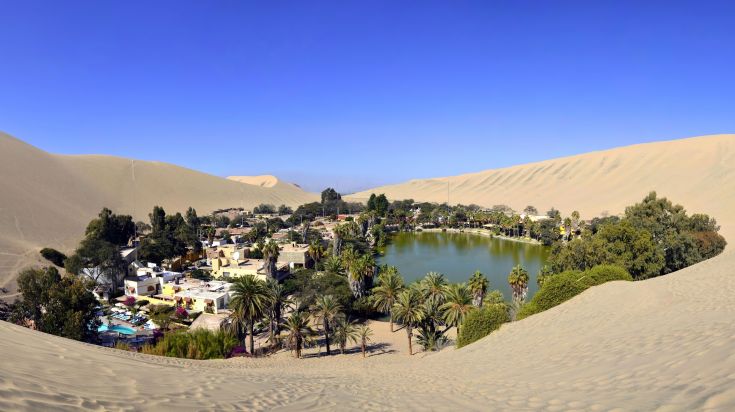 The magical town is called Huacachina that can be found in a barren desert