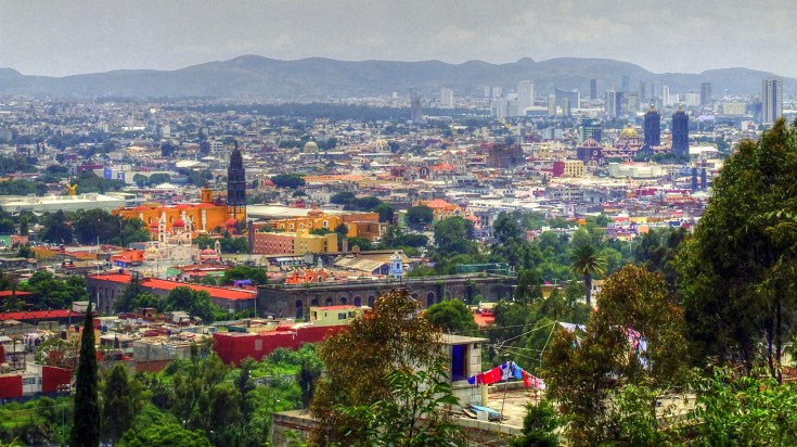 Puebla, a city in Mexico that lies in the Puebla Valley, surrounded by volcanoes and snow-capped mountains, slightly over 110 kilometers (68 miles) south-east of Mexico City. Panoramic view of Puebla city