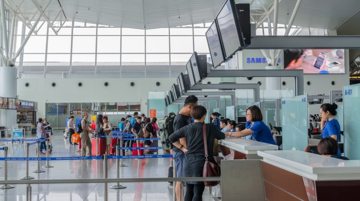 People checking in at Noi Bai Interntional Airport in Hanoi.