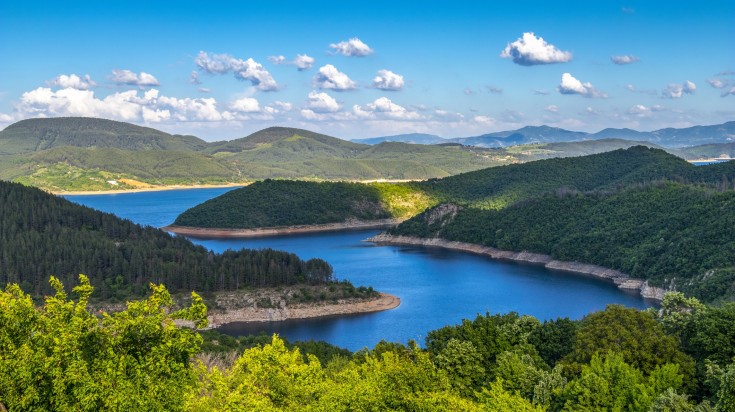 Greenery, blue river and sky with clouds at Kardzhali Reservoir. Greenery, blue river and sky with clouds at Kardzhali Reservoir.