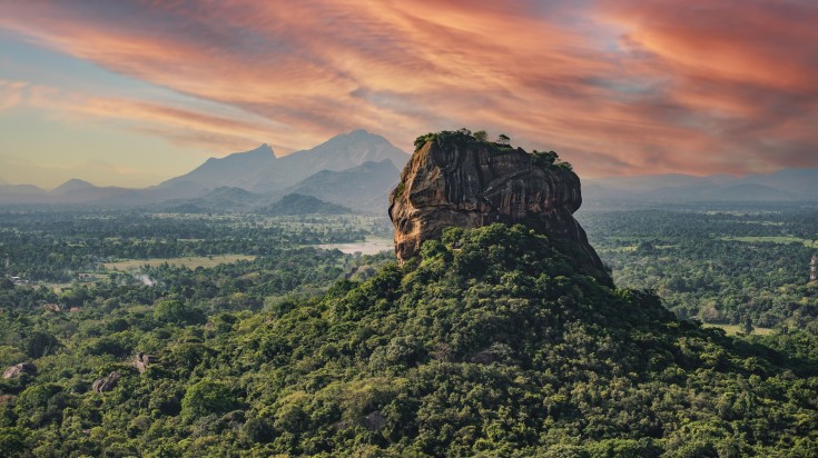 Lion Rock surrounded by spectacular greener under a red sky. Lion Rock surrounded by spectacular greener under a red sky.