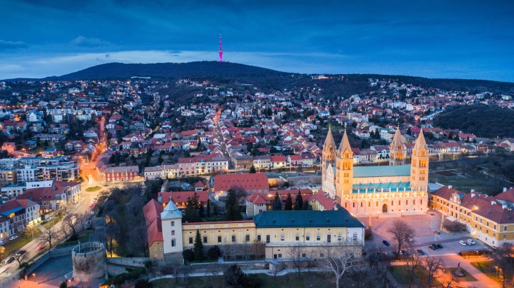 A bird's eye view of the city of Pecs at night.