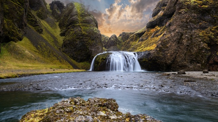 sunset at a waterfall in Iceland