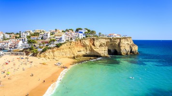 The scorching temperatures in Portugal in July make for the perfect reason to visit the many beautiful beaches, like the ones in Algarve. Beautiful beach in Carvoeiro Algarve Portugal