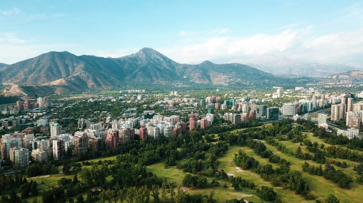 Lush green golf course in Santiago with the view of Andes mountain