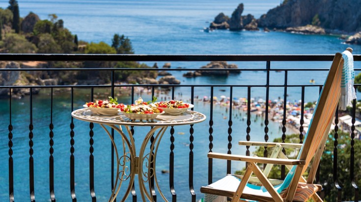 Food served on a sun terrace in Italy Sicilian pasta served on a sun terrace in Italy