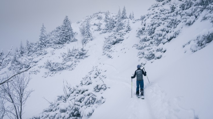 A man skiing in the snow of Bavaria, Germany.