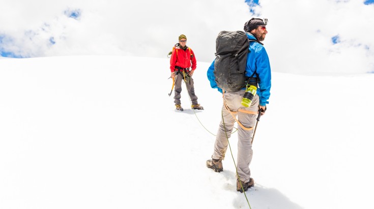 Two climbers snowshoeing at Andes.