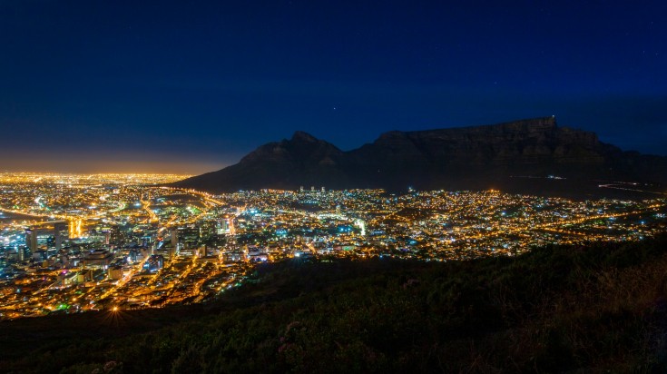 A scenic view of cityscape of Cape Town at night.