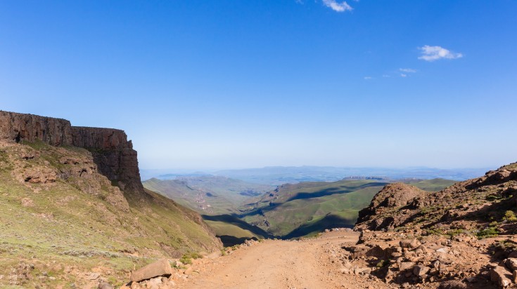 Mountains valley river overlooking horizon landscape in Sani Pass.