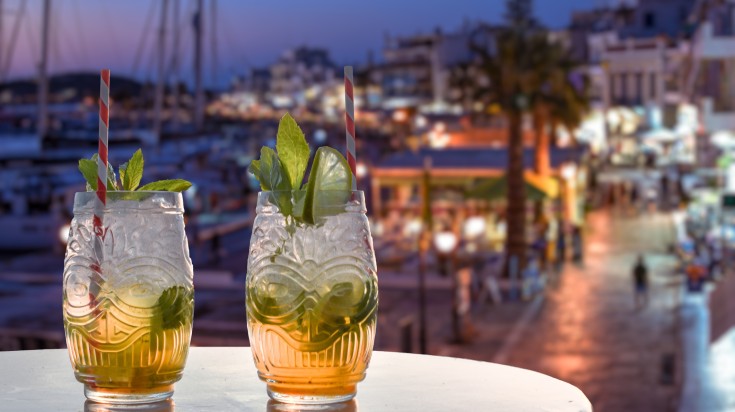 Two drinks overlooking the mediterranean harbor.