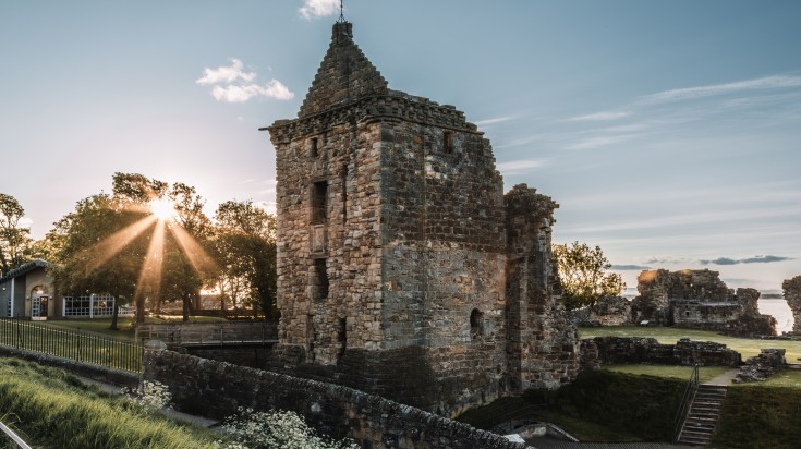 A close up view of the ruin of St. Andrews Castle in the sunset.