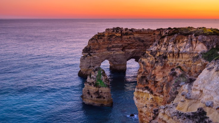 Beautiful sunset visible from the Praia da Marinha beach in Portugal.