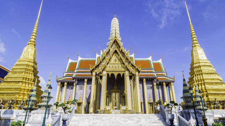 Temple of the Merald Buddha during a sunny day in Bangkok.