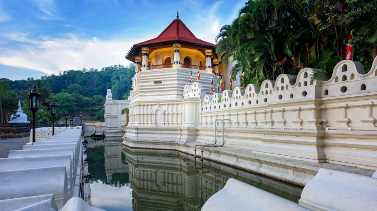 The Temple of the Sacred Tooth Relic in Kandy during a clear day.