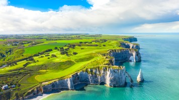 Explore history, nature, and cuisine in Normandy—an essential destination in France. The cliffs of Etretat, Normandy, best place to visit in france