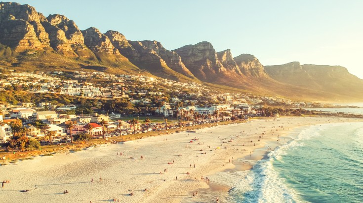 The sandy beach of Camps Bay, one of the best places to visit in January.
