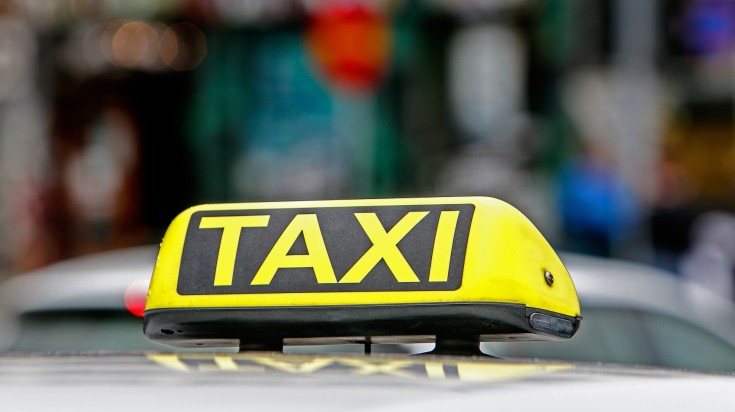 A close-up view of the familiar yellow taxi sign commonly seen in Iceland.