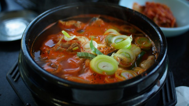 A bowl of red Haejangguk stew, a traditional Korean food.