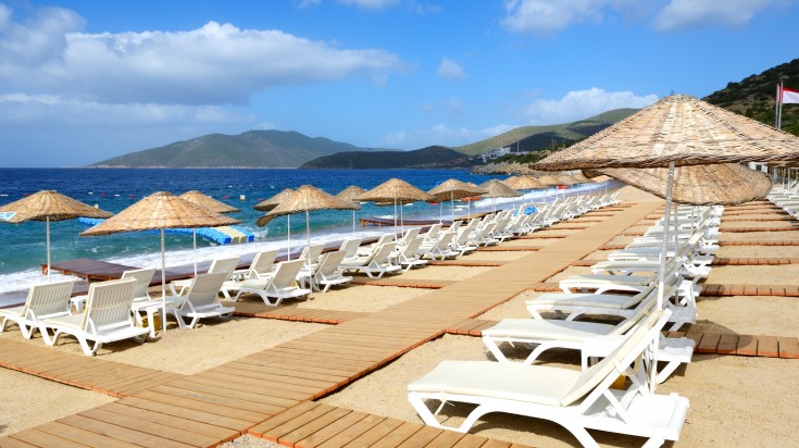 A beach with sand at a luxury hotel in Bodrum.