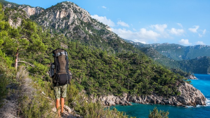 A backpacker hiking in the Lycian Way in Turkey.