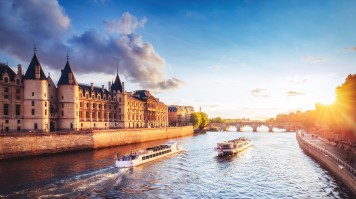 Two yachts cruising on river Seine of Paris. Two yachts cruising on river Seine of Paris.