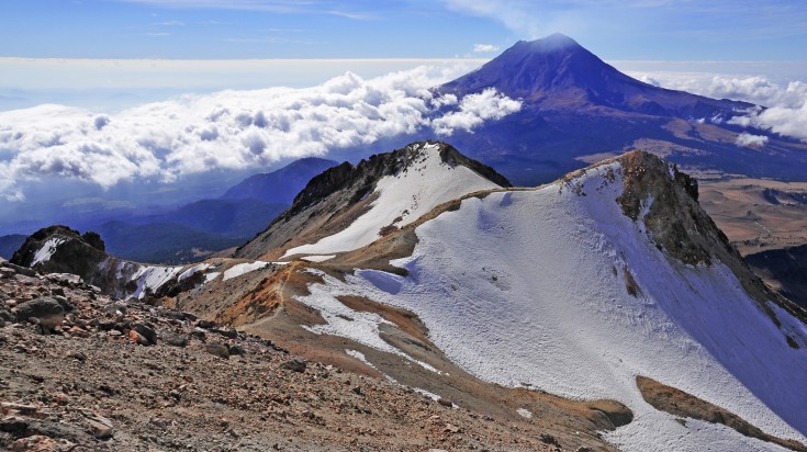 Iztaccíhuatl, the "Woman in White," presents the profile of a sleeping woman as seen from the Valley of Mexico. Iztaccihuatl is the third highest mountain in Mexico