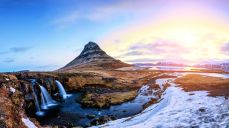 Spring sunrise over the famous Kirkjufellsfoss Waterfall with Kirkjufell mountain. Kirkjufellsfoss waterfall in Iceland