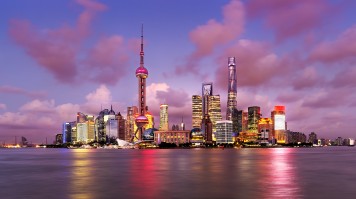 Panoramic, evening view of Pudong's skyline from The Bund