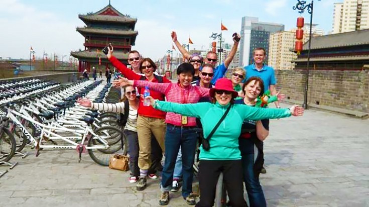 Tourists taking group photo at the Xian City Walls before visiting Tibet