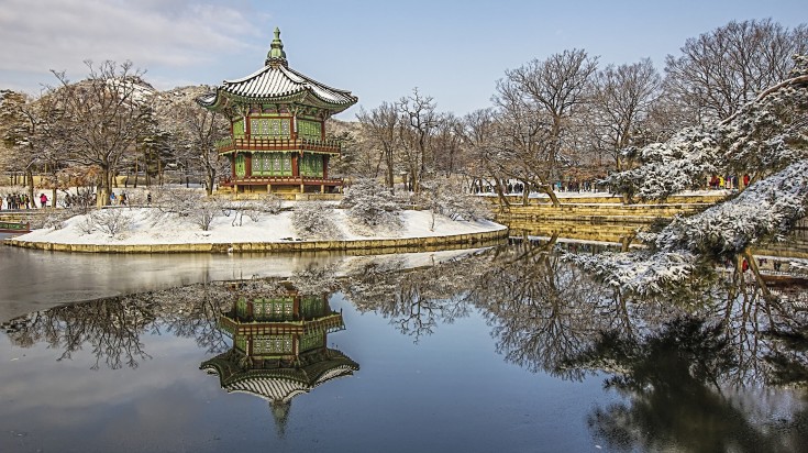 Seoul's Palace, draped in winter's charm, amidst the serene beauty of South