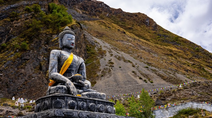 A statue of The Holy Tibetan Buddha shrine of Muktinath in Nepal in August.